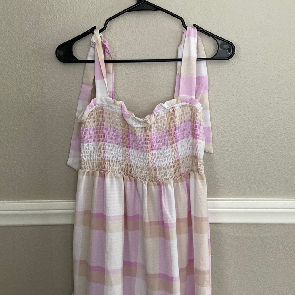 New without tags. Purple, cream and white dress. Super girly and fun dress